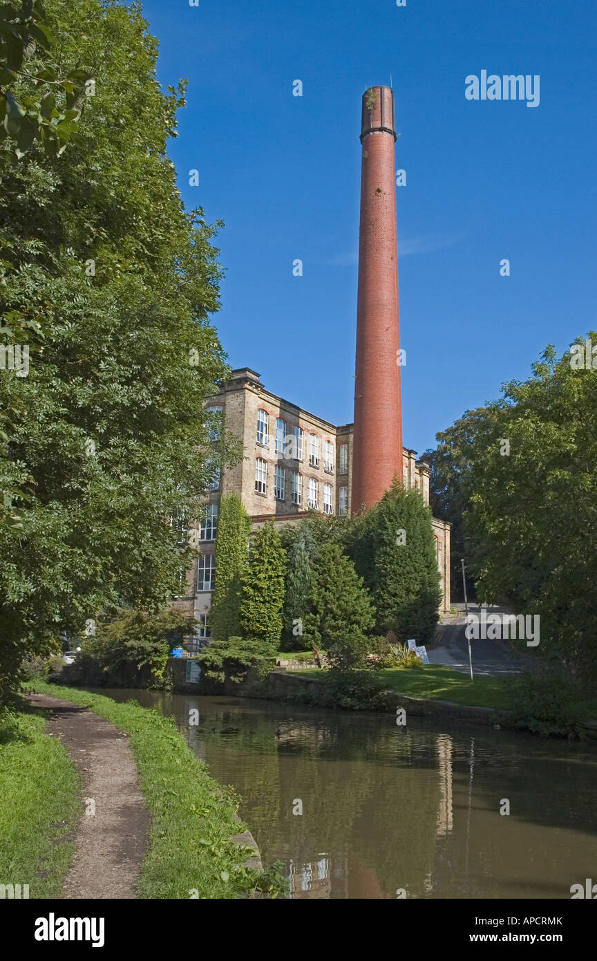 UK Cheshire Bollington Leeds Liverpool canal Clarence Mill 1820 converted to house small industrial units Stock Photo