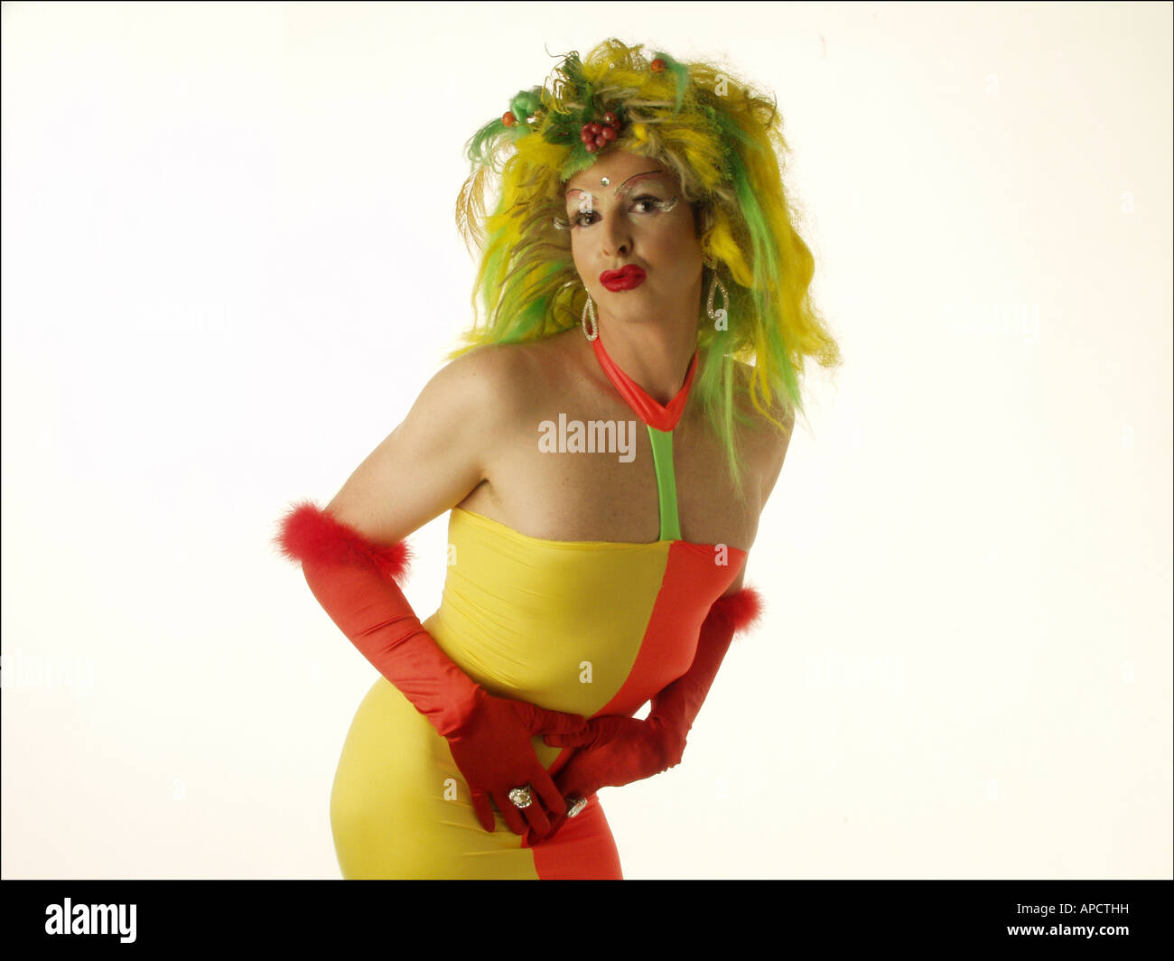 Sassy transvestite in yellow and orange tube dress Stock Photo - Alamy
