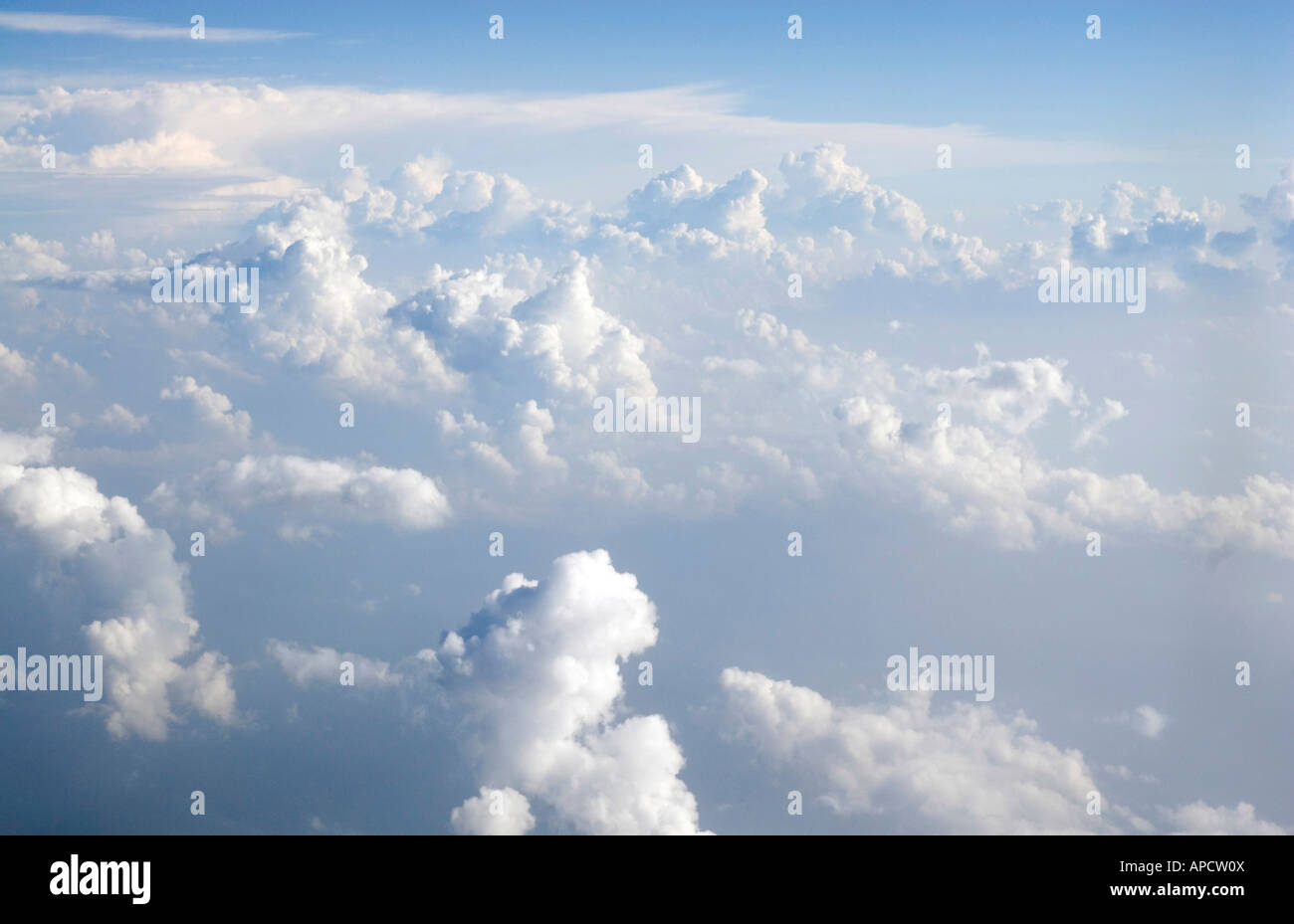 Flying over white clouds, blue sky Stock Photo
