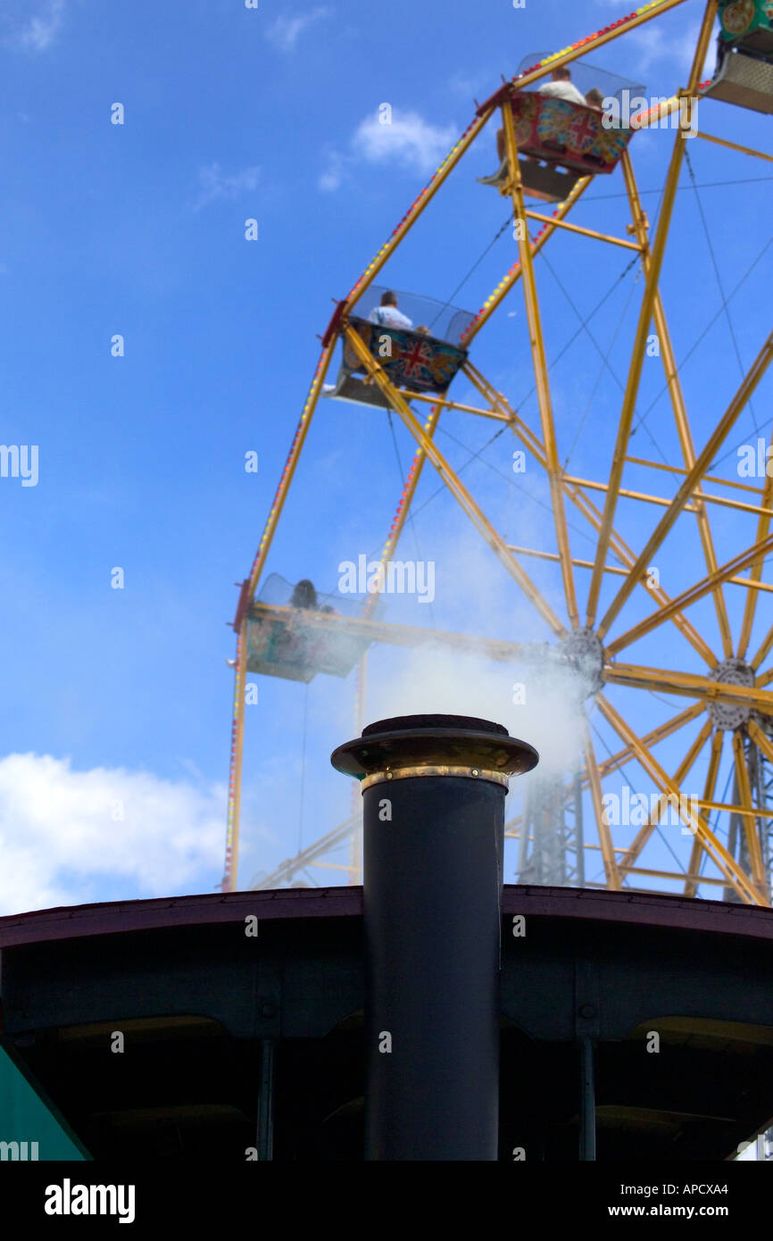Steam engine funnel with steam and ferris wheel Stock Photo Alamy