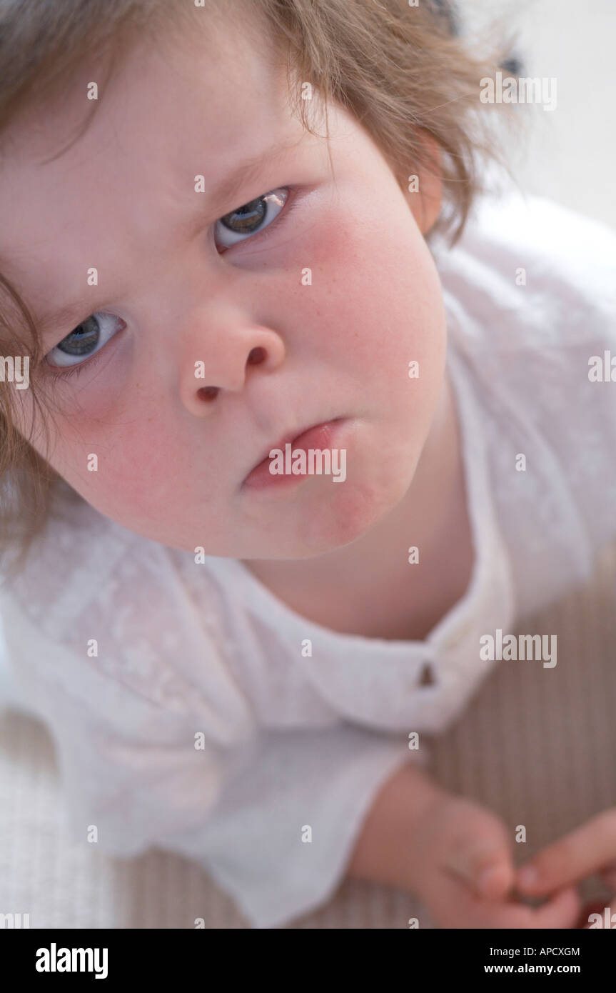 Toddler frowning Stock Photo
