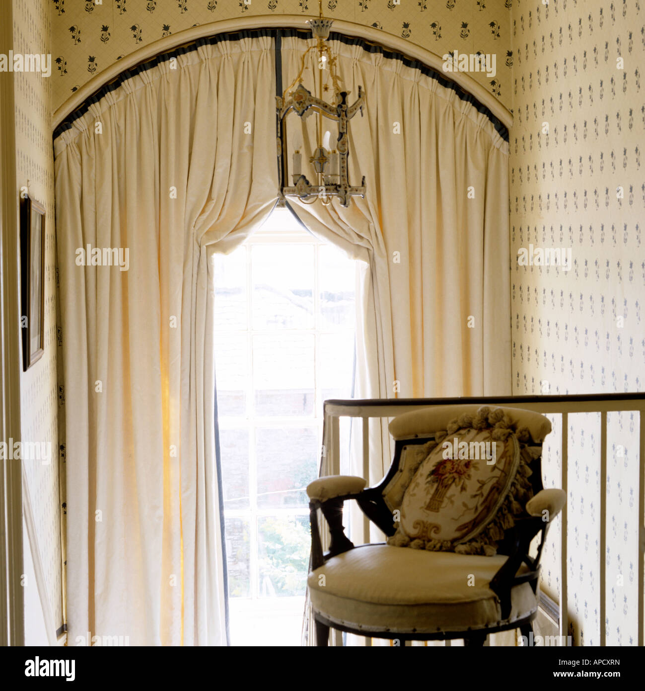 curtain treatment of doubleheight arched window in an Irish