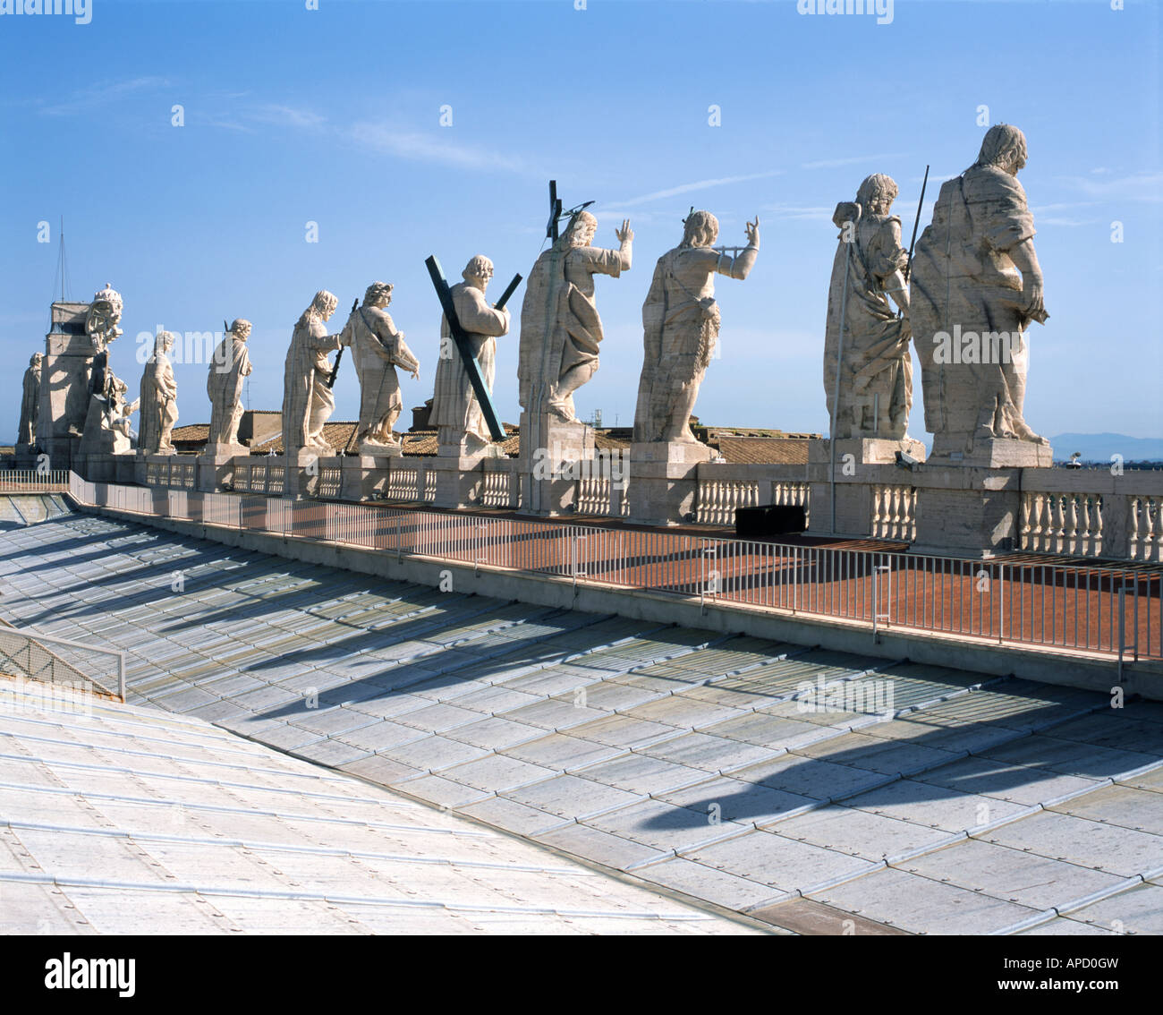 Statues of Christ, John the Baptist, and eleven of the apostles on the roof top St. Peter's Basilica, Vatican City Stock Photo