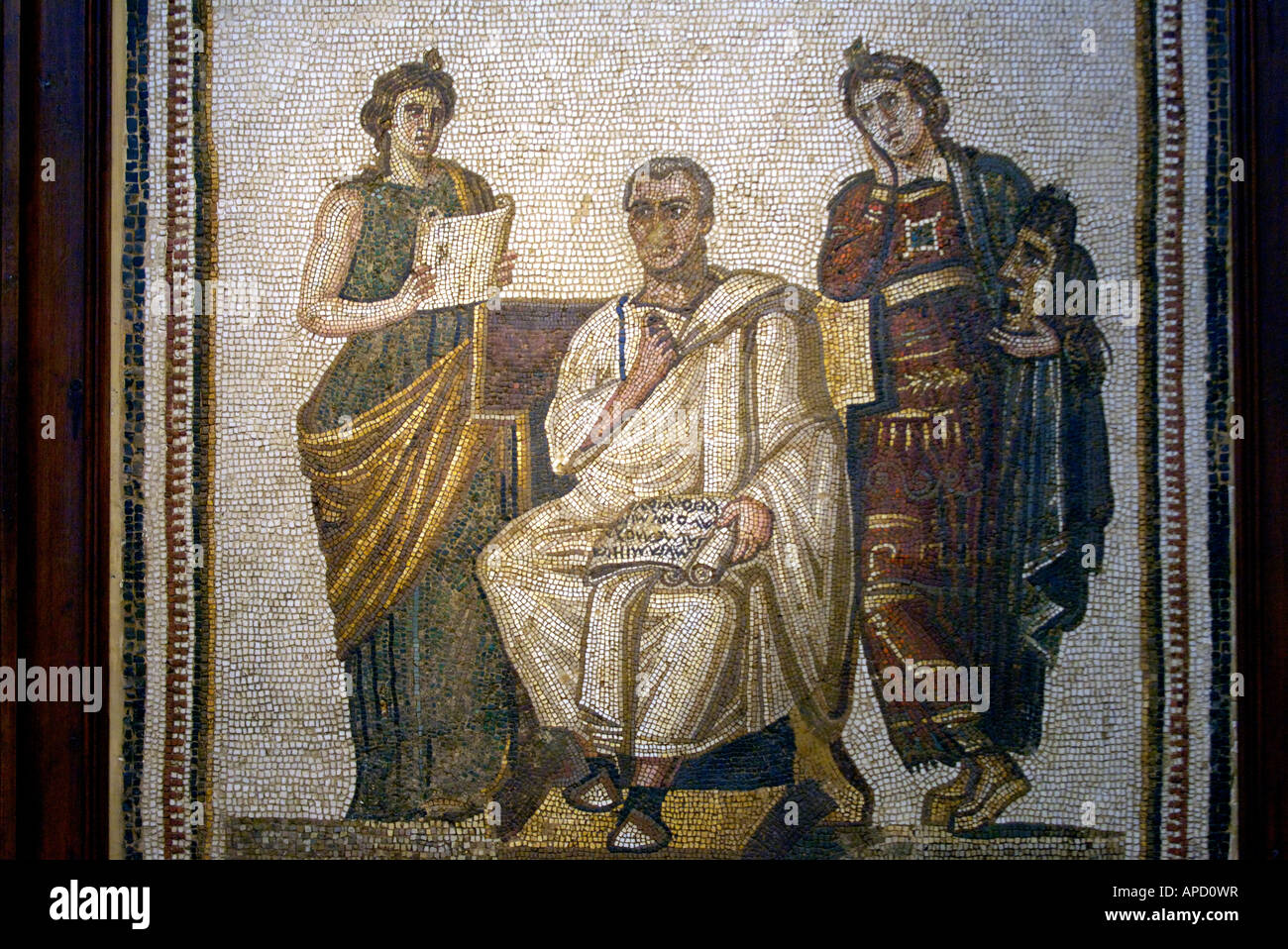 A mosaic of Virgil holding a volume of the Aenid flanked by the Muses Clio and Melpomene, in the Bardo Museum Stock Photo