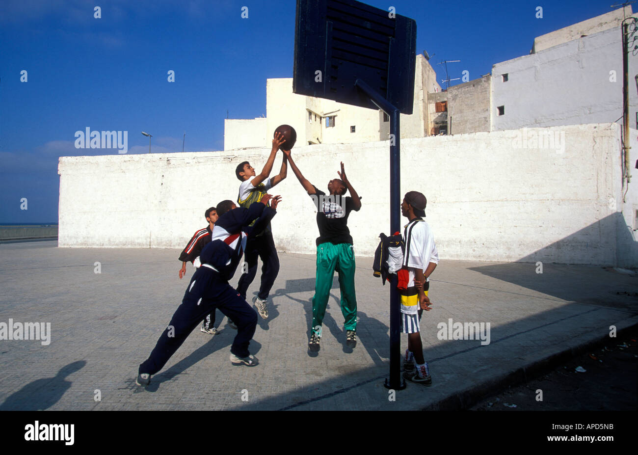 Africa Morocco Casablanca Youths play basketball at outdoor court in