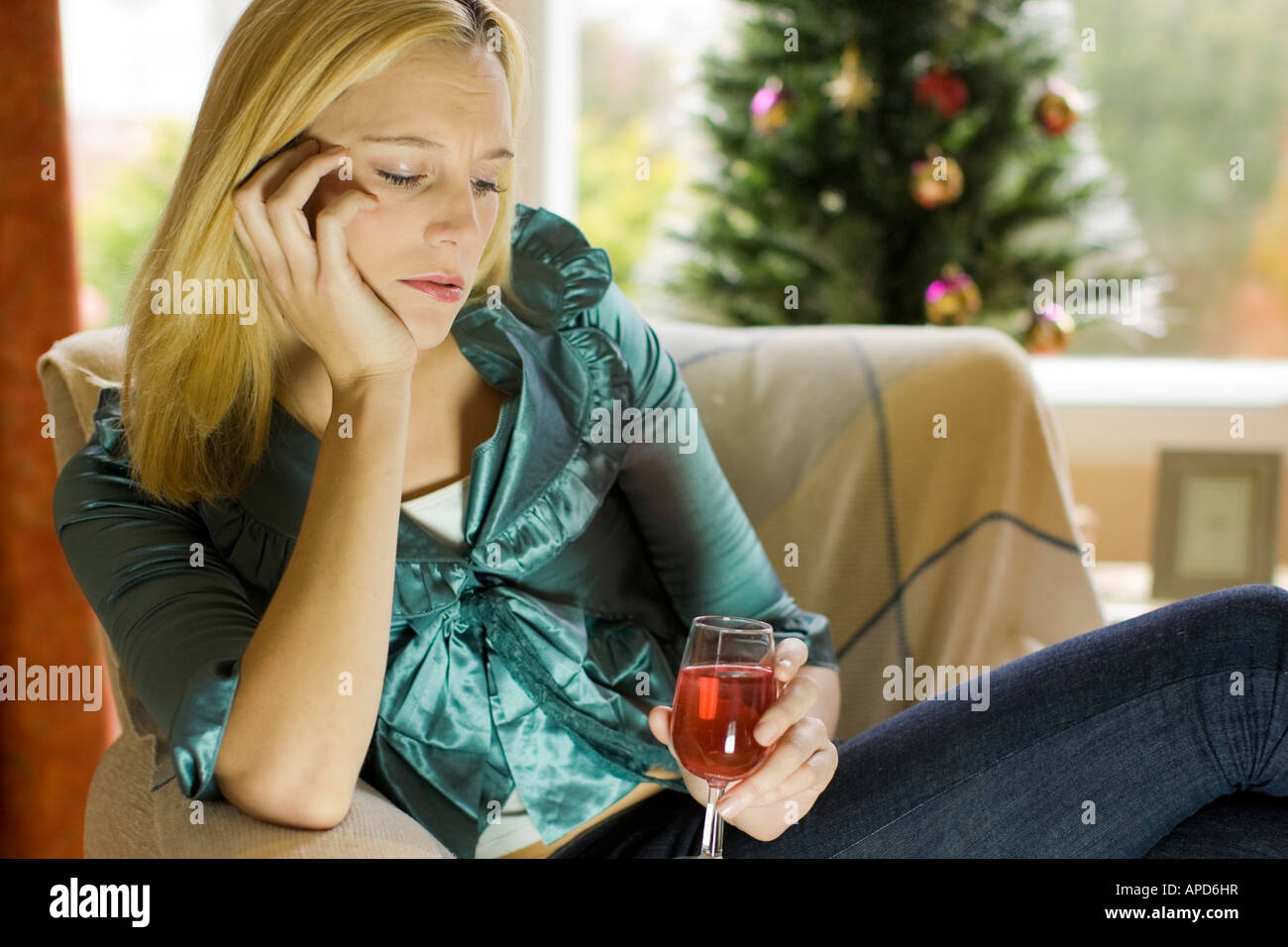 Woman alone at Christmas with glass of wine Stock Photo Alamy Alone At Christmas