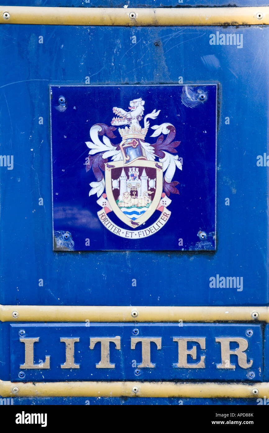 Closeup of a litter bin in Guildford, displaying the town's coat of