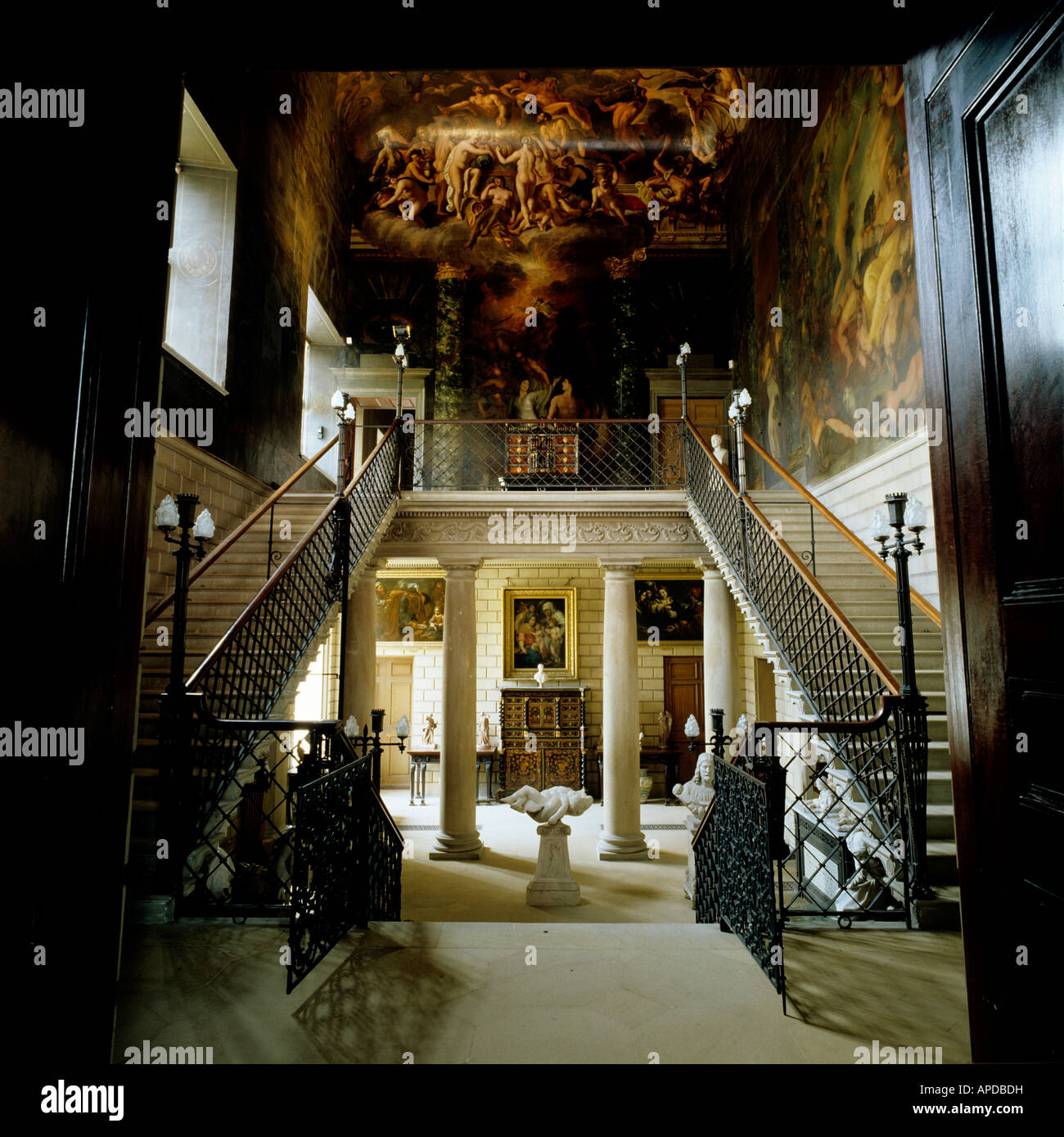 Grand entrance with staircase and colonnaded hall in English stately