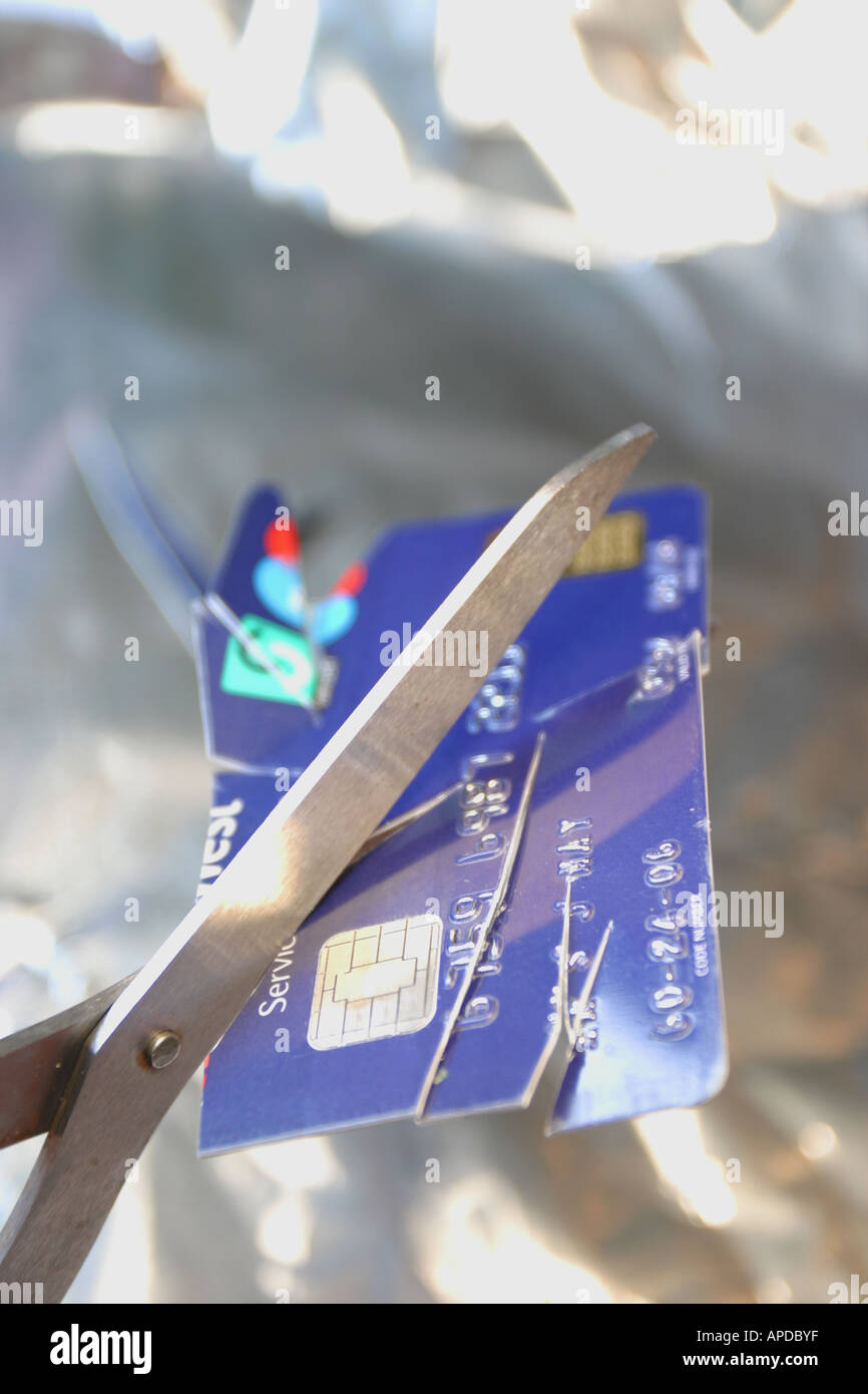 Cutting up a credit card Stock Photo