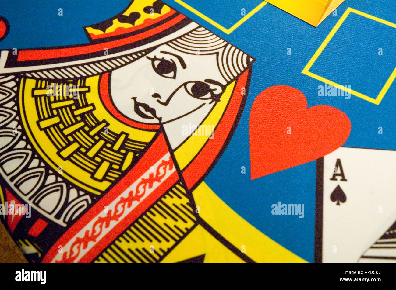 Gambling gaming queen of hearts on felt Stock Photo