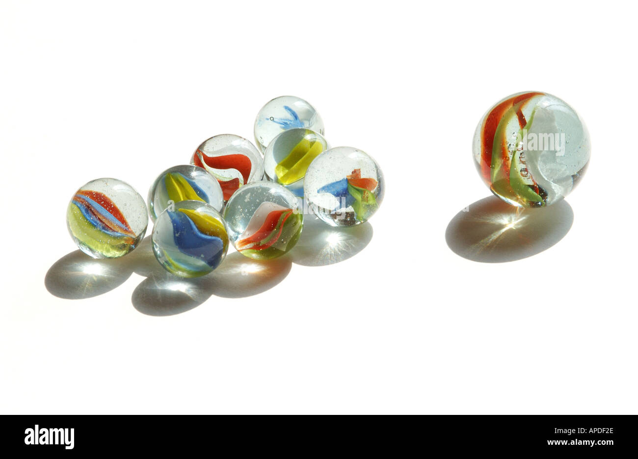 Purey Childrens coloured glass marbles on white background Close up Stock ...