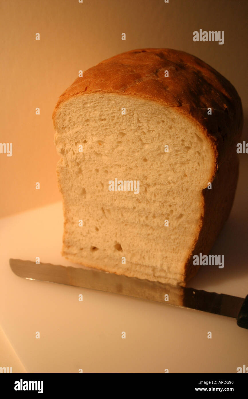 bread and knife on cutting board Stock Photo Alamy