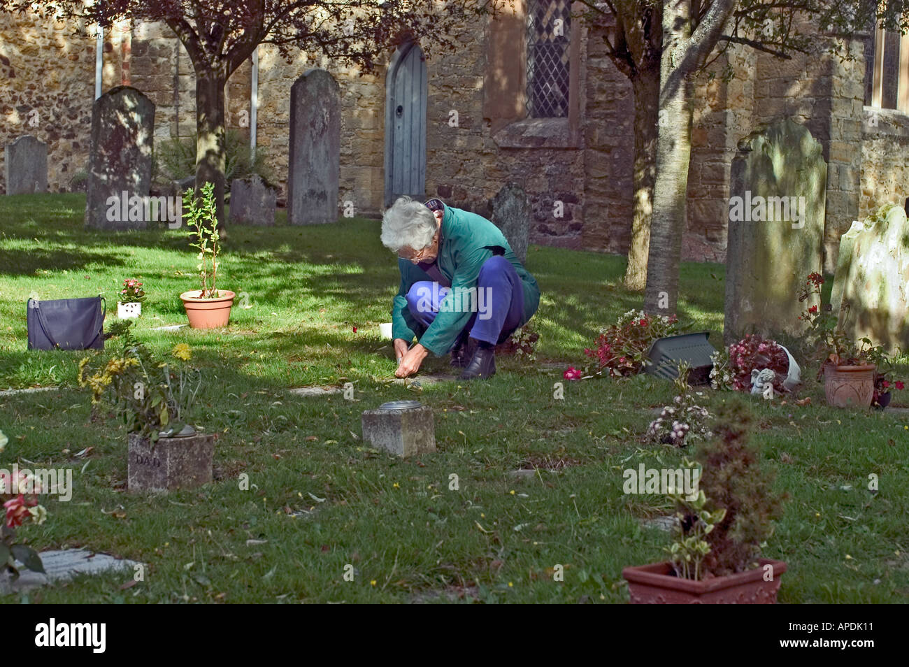 Attending the Grave Stock Photo
