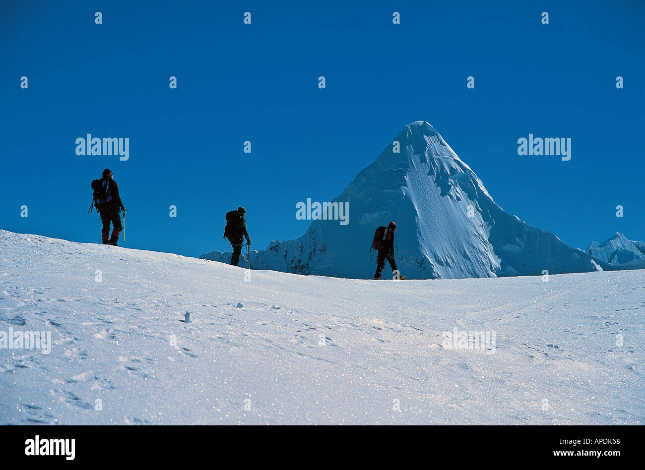 A party of three climbers going to Pisco, Cordillera blanca, Peru. Stock Photo