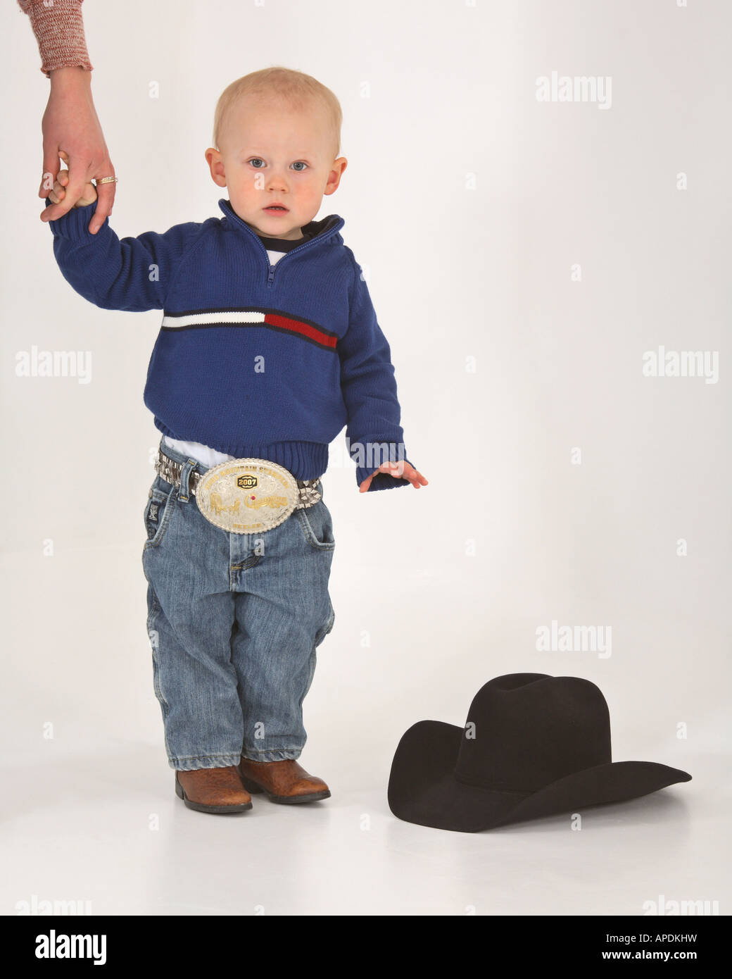 Cowboy holding belt buckle hires stock photography and images Alamy