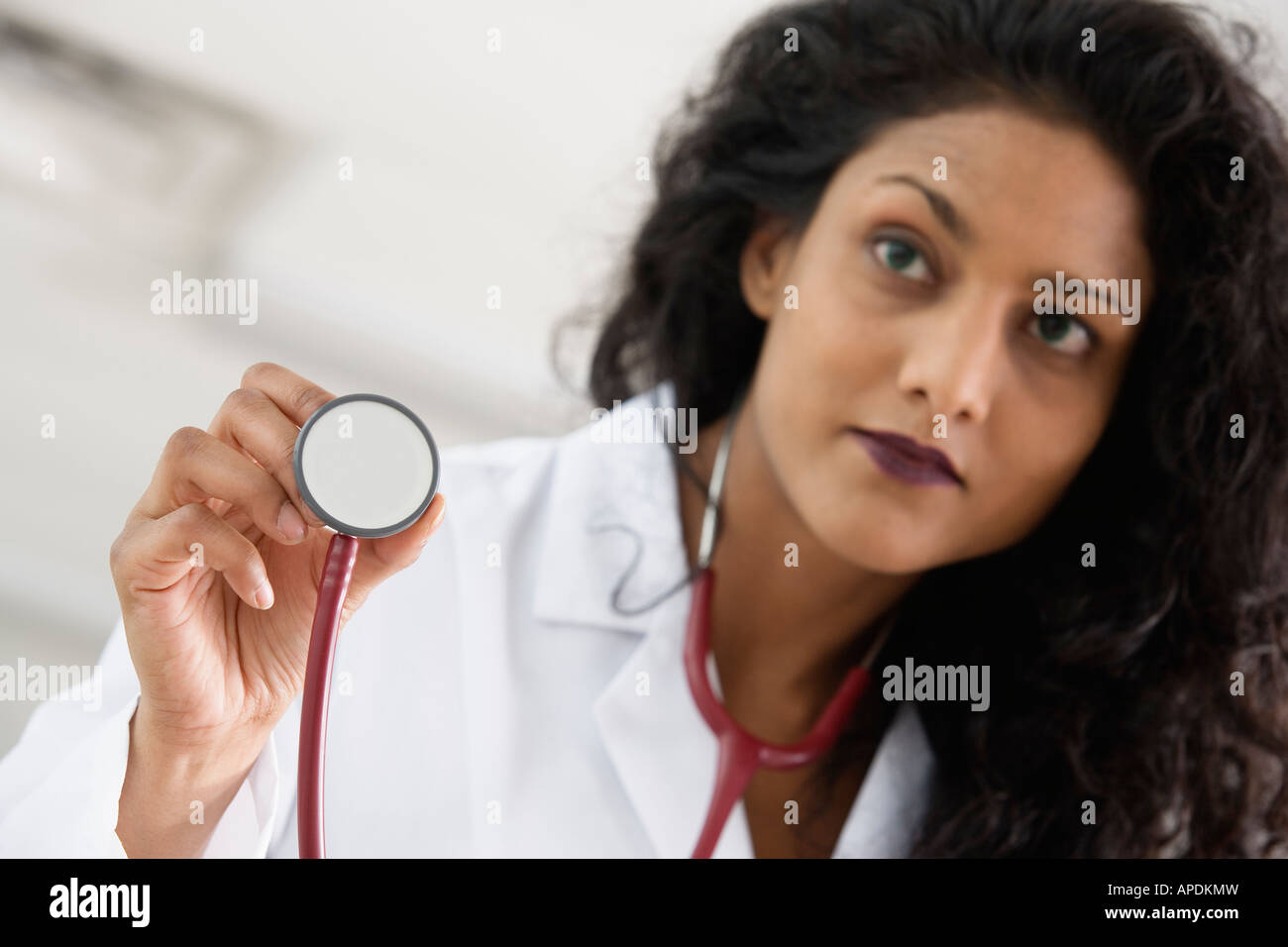 Nurse holding a stethoscope Stock Photo - Alamy