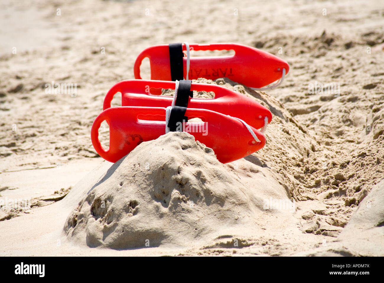 A view of lifeguard rescue cans on a beach by the ocean Stock Photo - Alamy