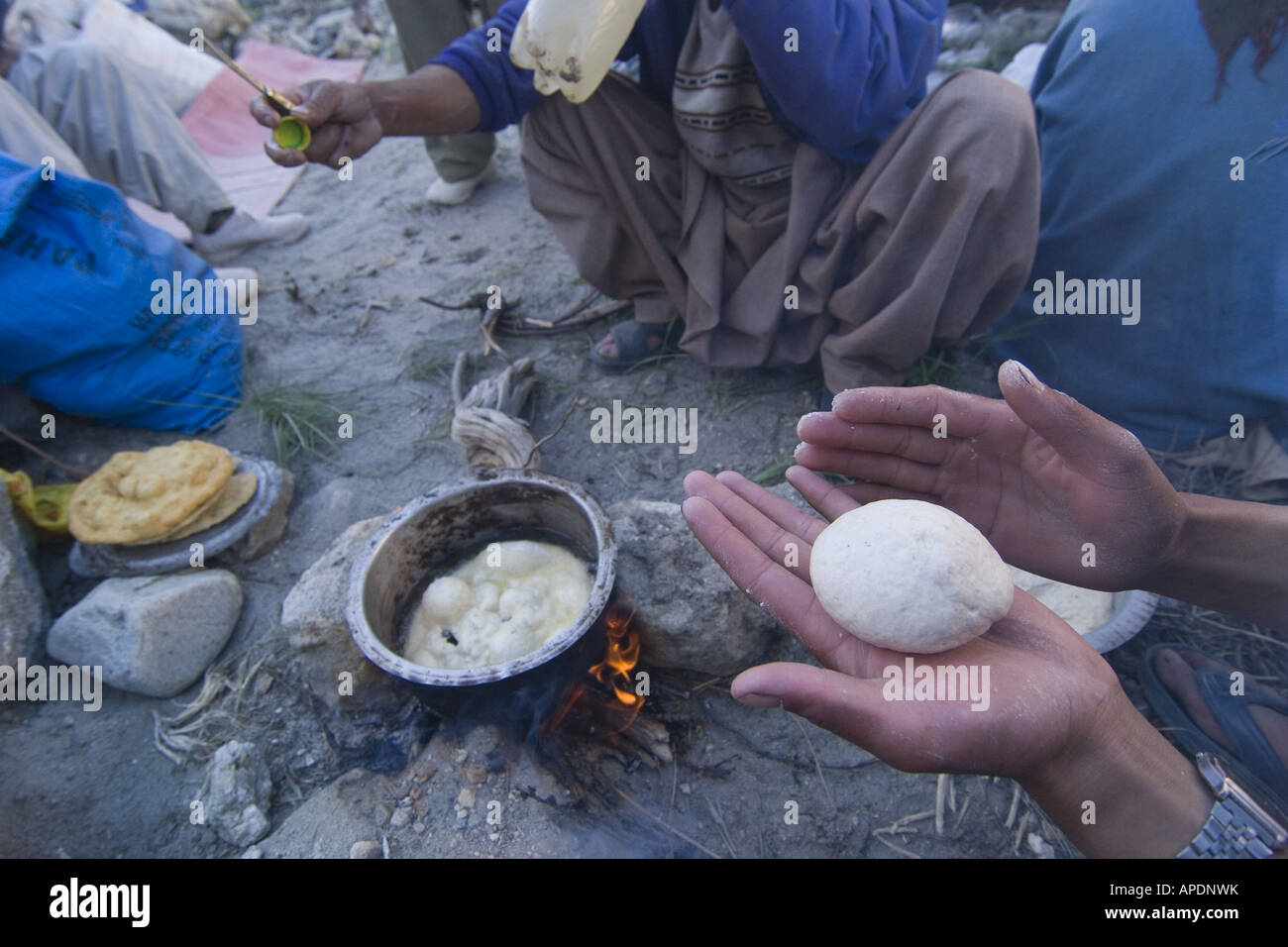 A Balti man making chapatis in Pakistan Stock Photo