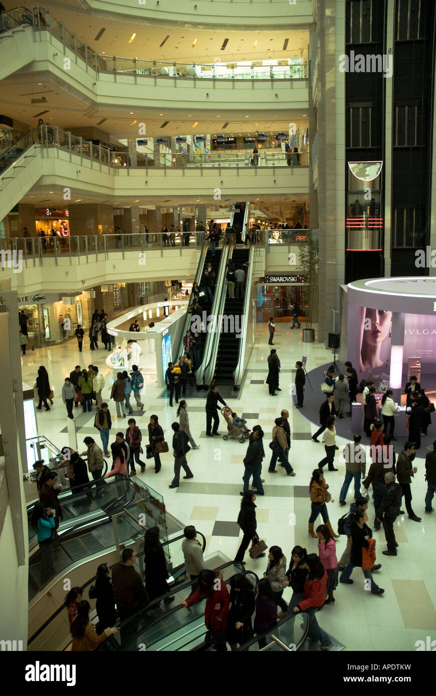 Crowds in multi-story shopping mall near Xijahui Metro station in Shanghai  Stock Photo - Alamy