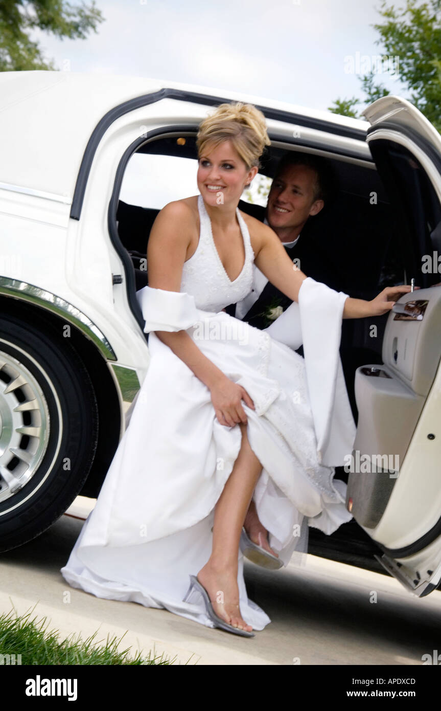 Bride and groom in limo Stock Photo - Alamy