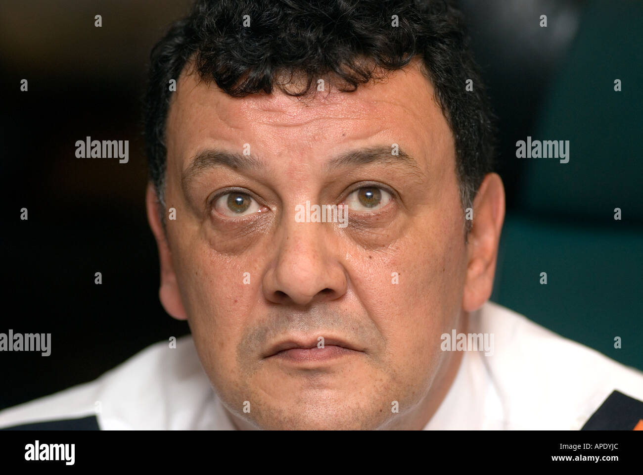 Security guard on duty in CCTV control room studying cctv screens