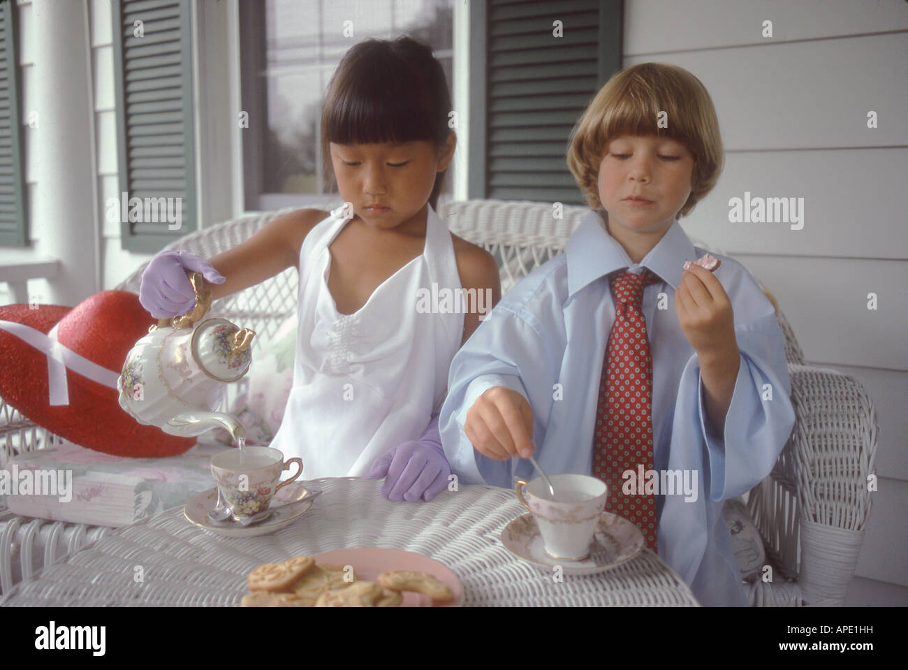 Boy girl playing tea party hi-res stock photography and images - Alamy