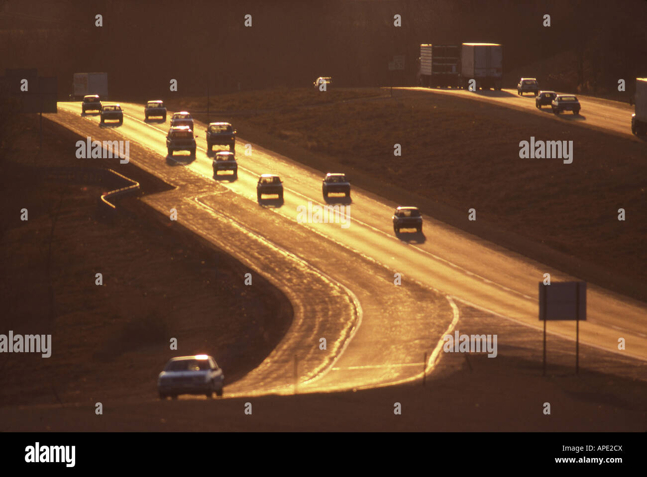 Highway, sunset, trucks,cars Stock Photo Alamy