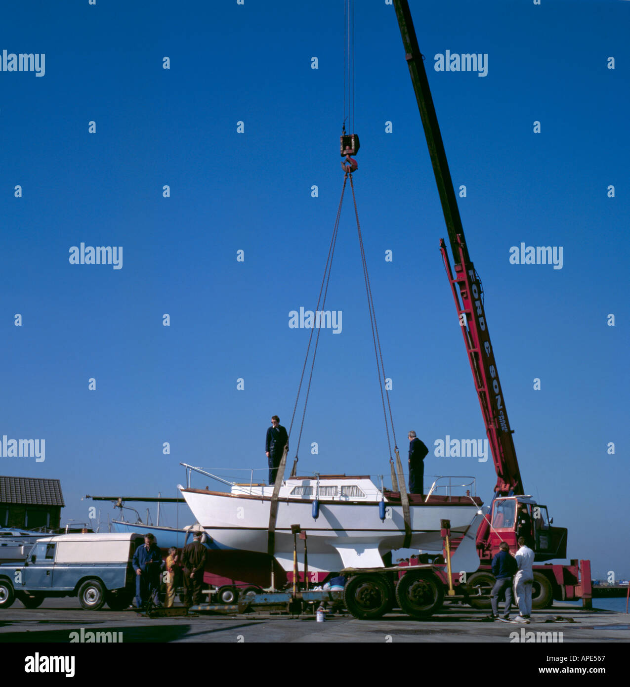 Crane lifting small boat hi-res stock photography and images - Alamy