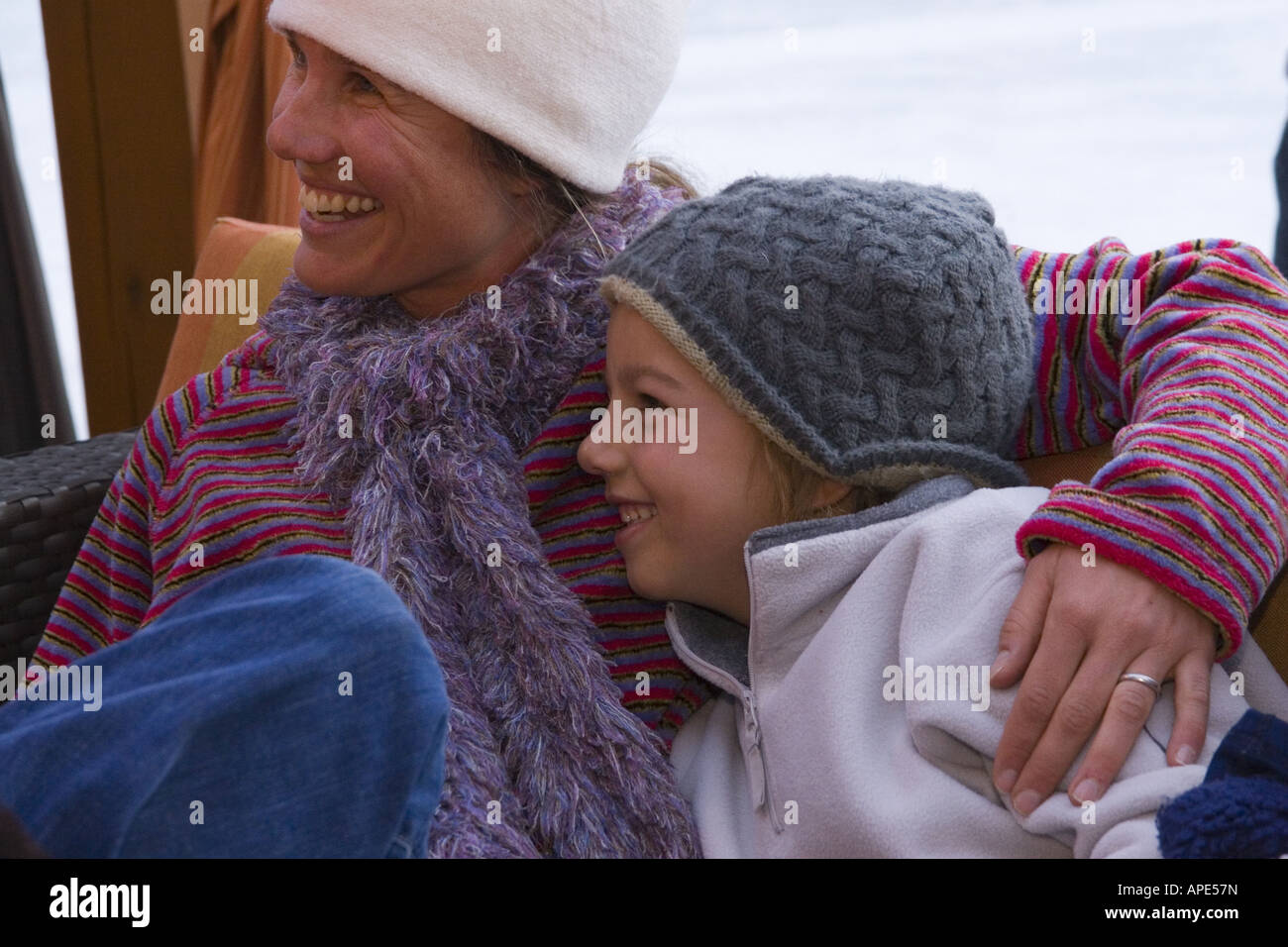 A mother and her young son relaxing outdoors at Northstar ski resort near Lake Tahoe in California Stock Photo