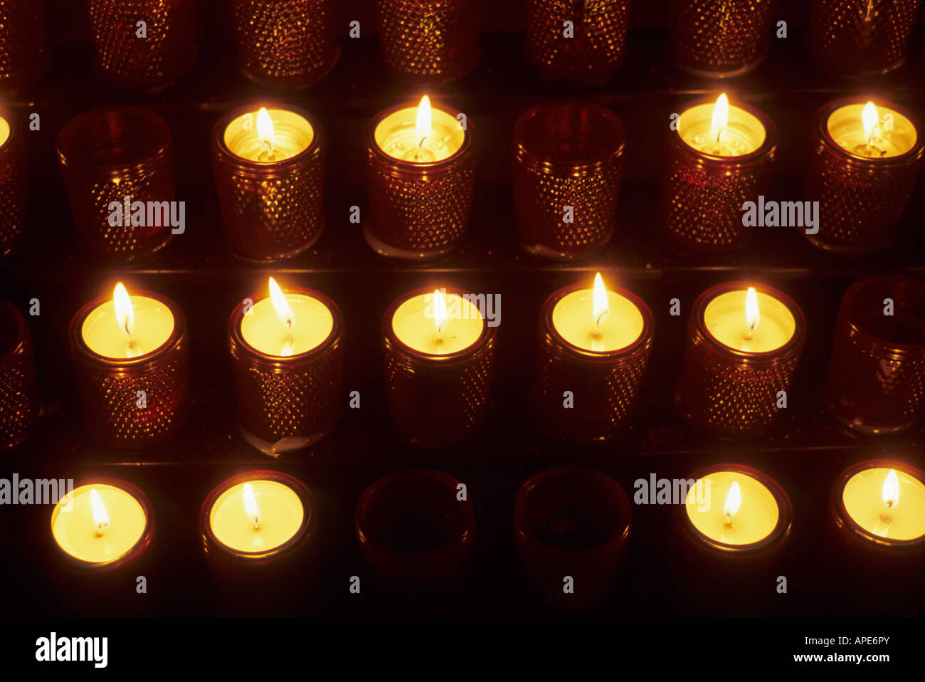 Votive candles in a church symbolize Christian prayers Stock Photo Alamy