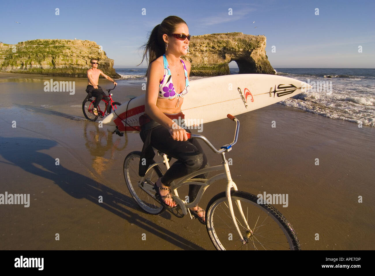 Young man woman riding cruiser hi res stock photography and images