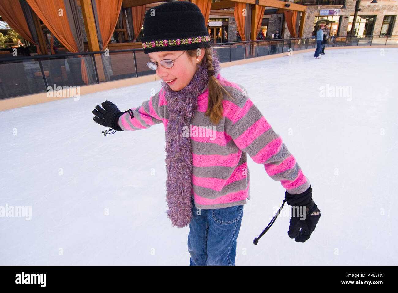A young girl ice skating at Northstar ski resort near Lake Tahoe in California Stock Photo
