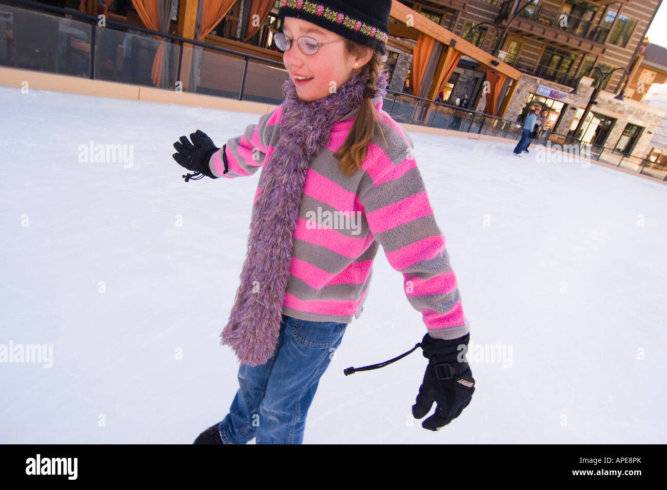 A young girl ice skating at Northstar ski resort near Lake Tahoe in California Stock Photo