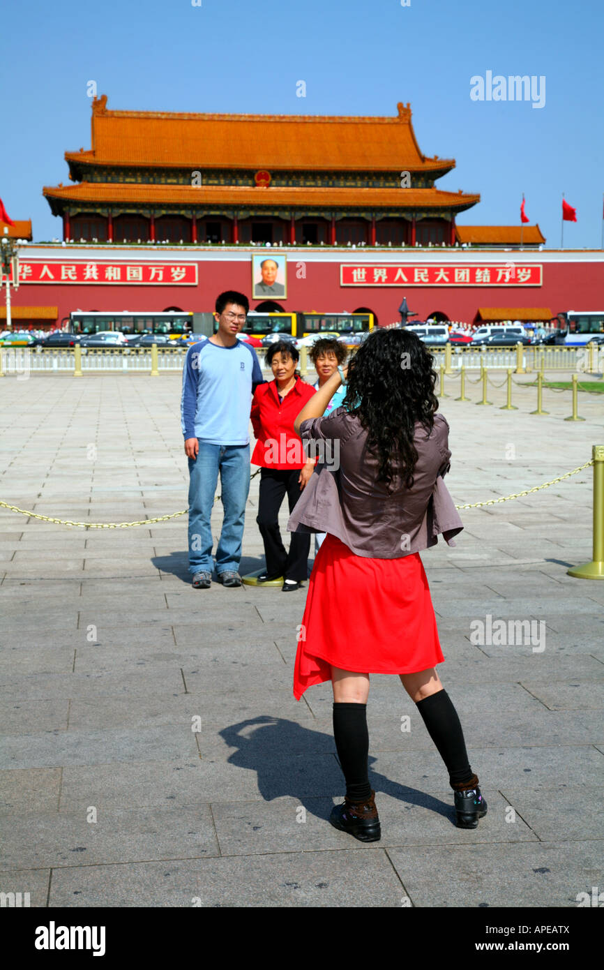 Family group at Tiananmen Square, Beijing, taking pictures in front of Imperial Palace. Stock Photo