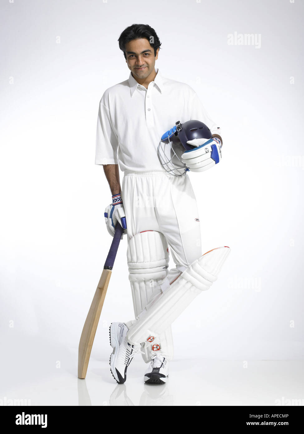 Indian batsman holding helmet and bat ready for cricket match Stock