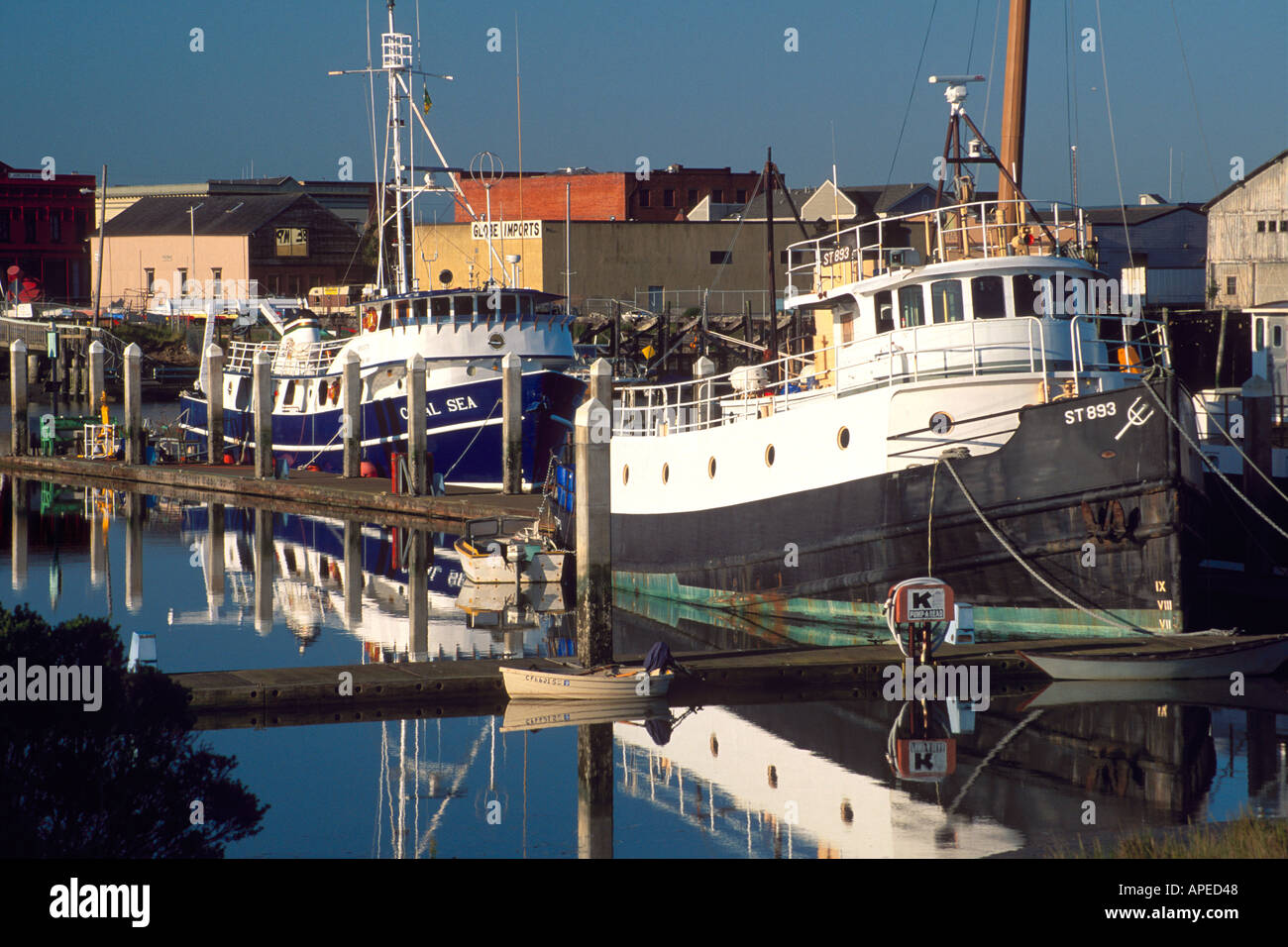 Commercial fishing industry ship boat vessel tied up at dock berth in