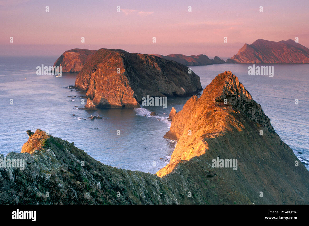 Sunrise light on Pacific Ocean and steep coastal cliffs from Inspiration Point Anacapa Island Channel Islands California Stock Photo