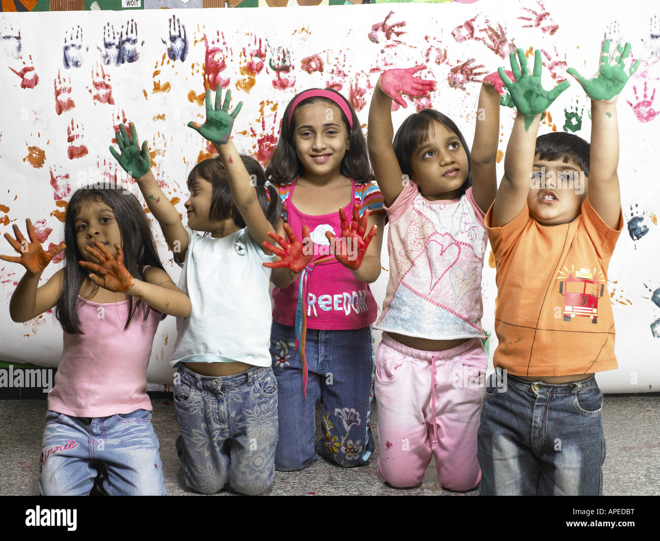 Indian Child Color Hand South Asian Indian boy and girls showing hand palms covered with paint ...