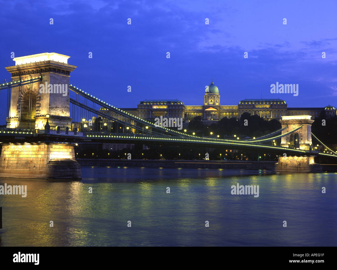 Chain Bridge and Royal Palace at night seen across Danube, Budapest, Hungary Stock Photo