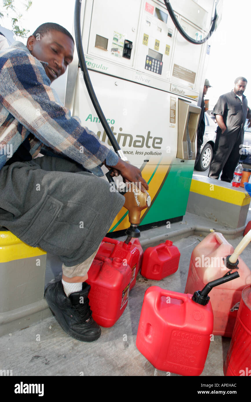 Miami Florida,Biscayne Boulevard,gas lines after weather,Hurricane Wilma,Black Blacks African Africans ethnic minority,adult adults man men male,plast Stock Photo