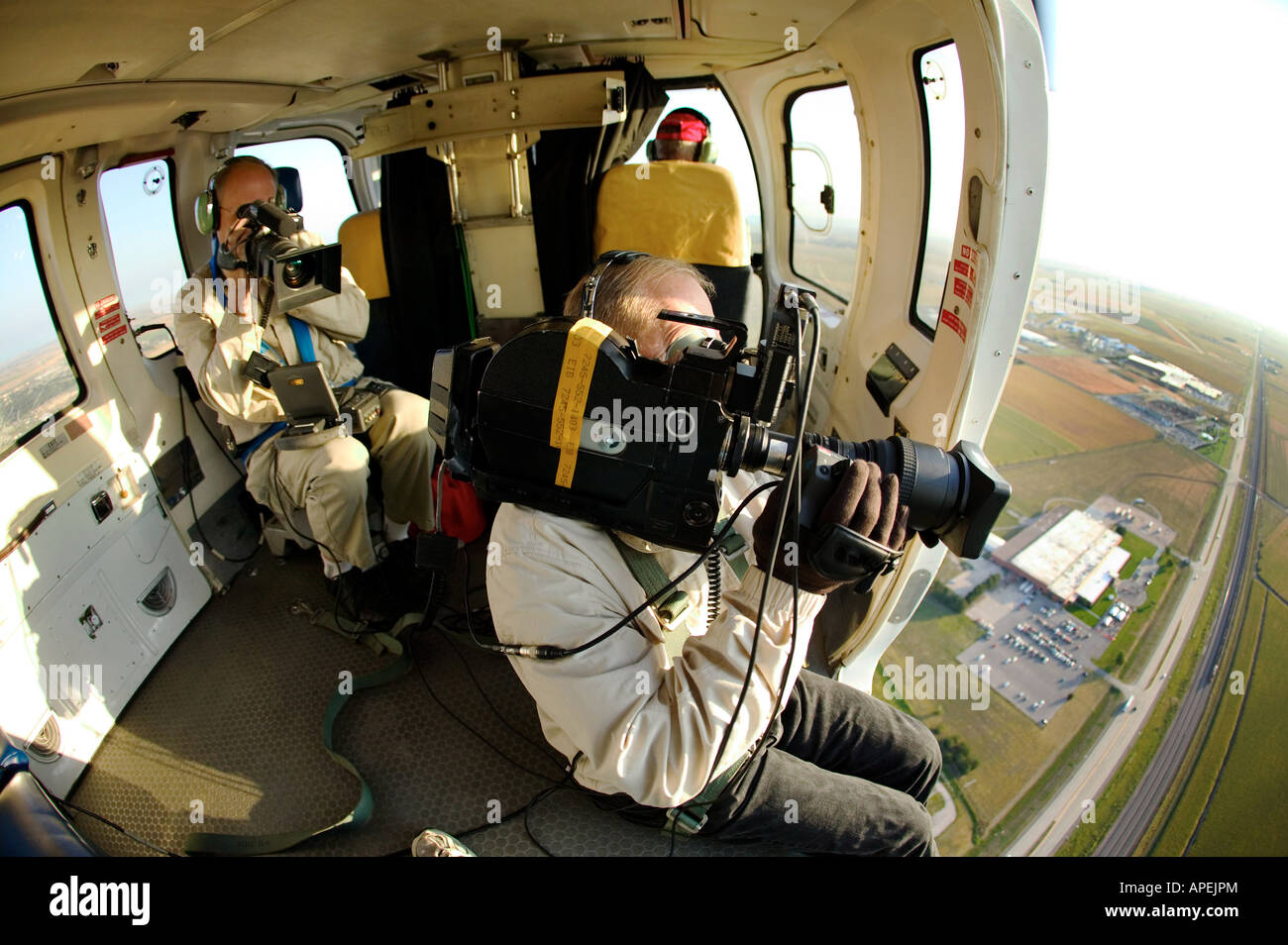 news team in helicopter Stock Photo