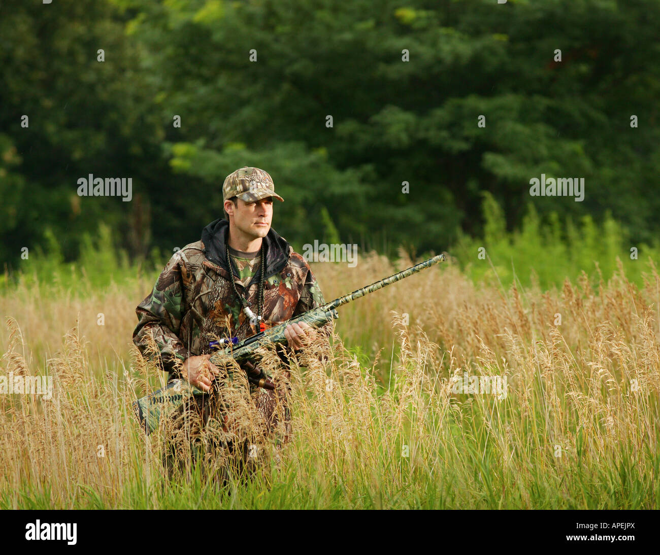 Hunter holding rifle looking away hi-res stock photography and images ...