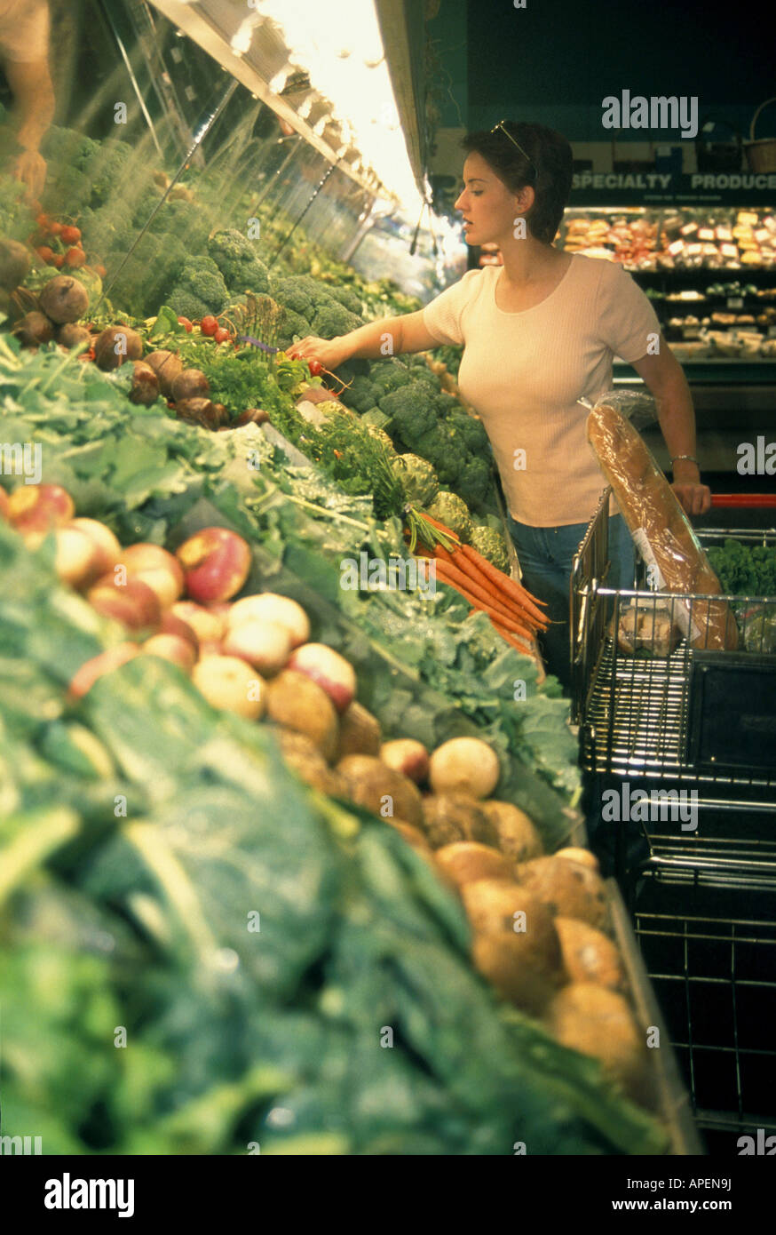 Woman shopping in grocery store. Stock Photo
