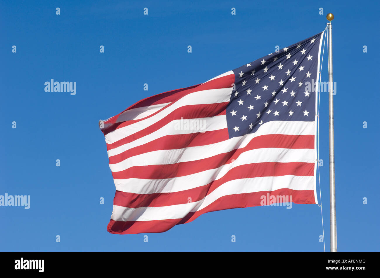 The American flag blows in the breeze. Stock Photo