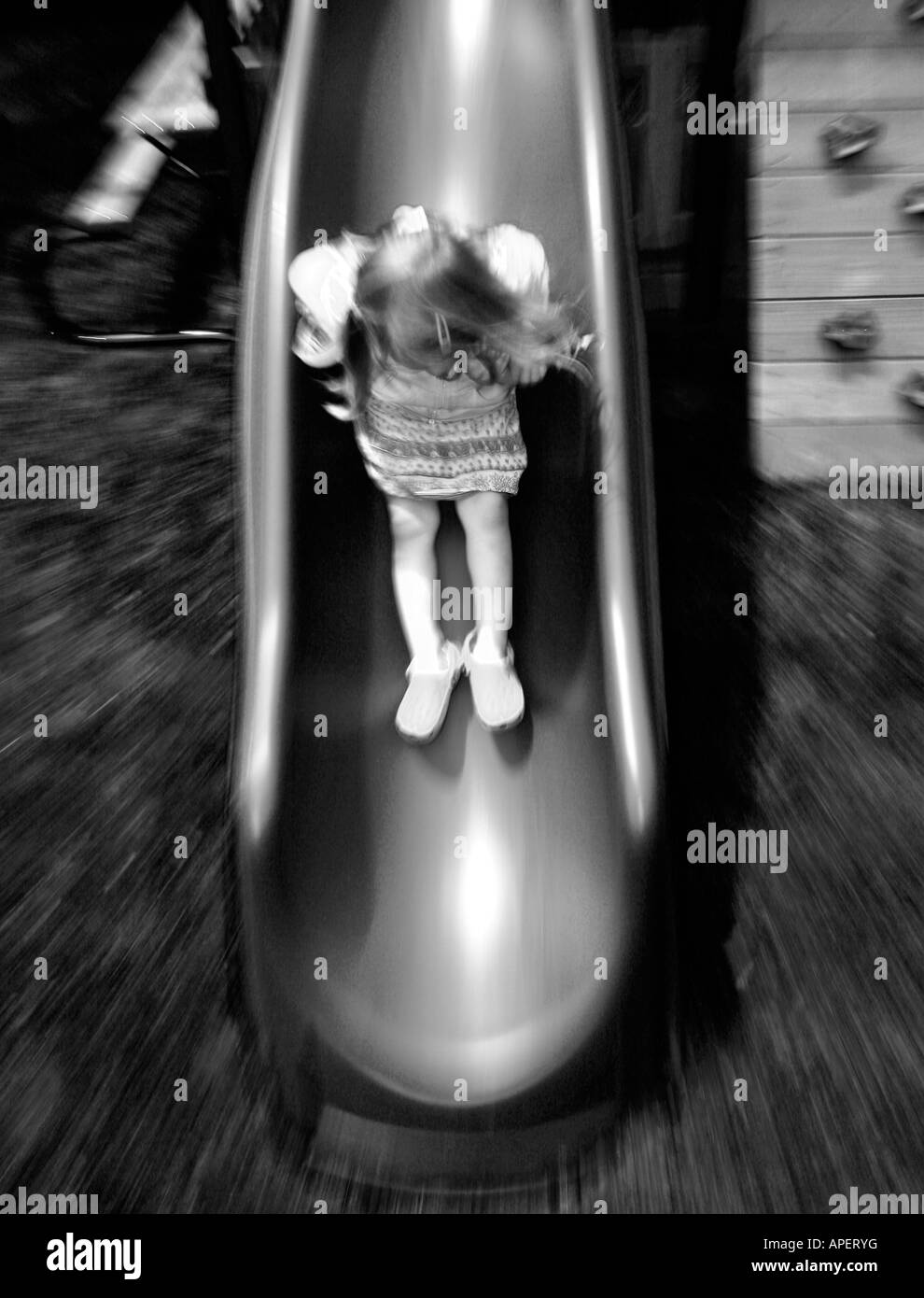 Little girl on a sliding board Stock Photo Alamy