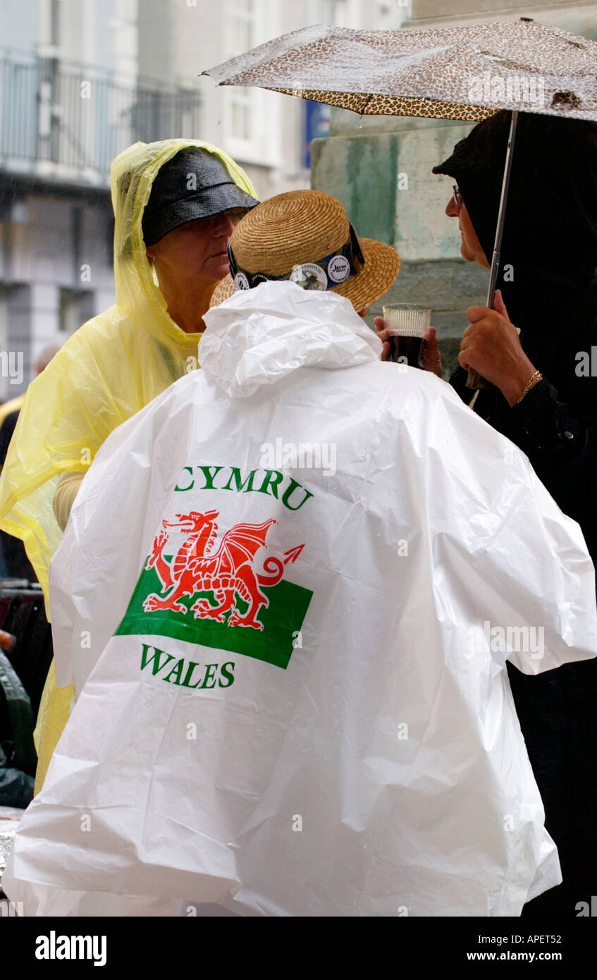 Person in Cymru Wales red dragon rain poncho at the annual Brecon Jazz  Festival Powys Wales UK Stock Photo - Alamy