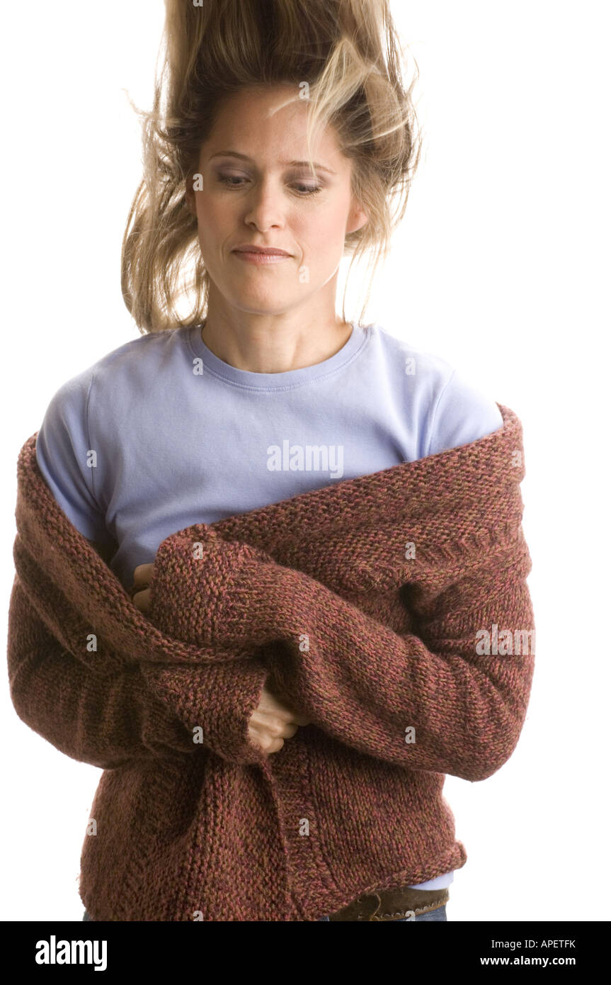 Woman in bulky sweater on a bad hair day Stock Photo