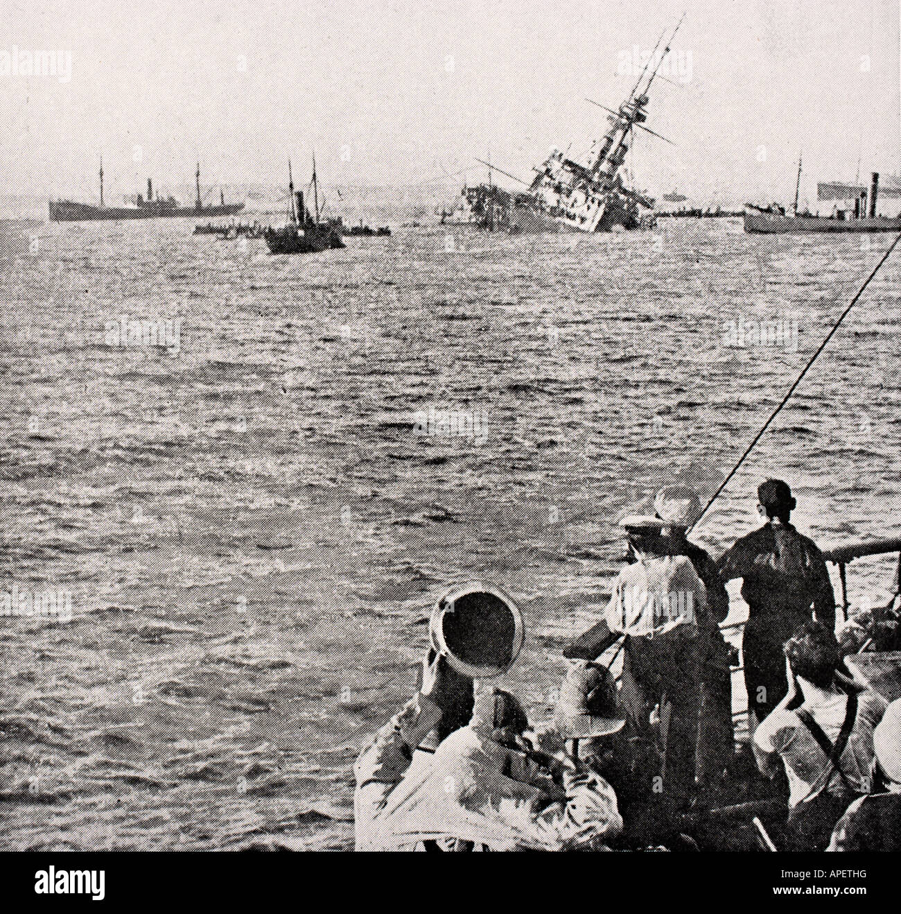 HMS Majestic sinking May 27, 1915 after being hit bya  torpedo off the Gallipoli Peninsula, Turkey during WWI. Stock Photo