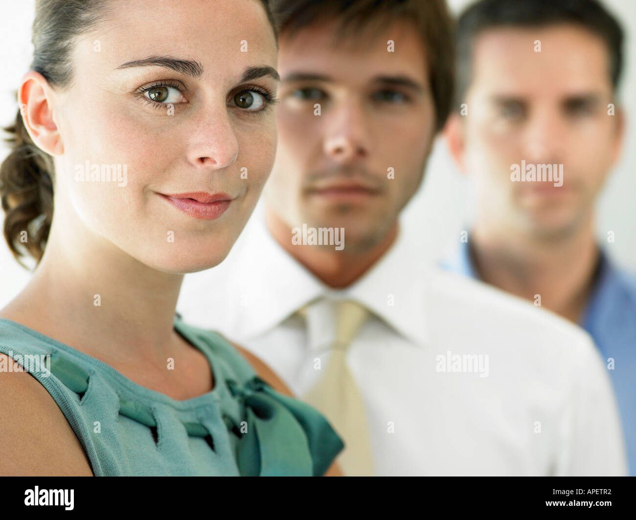 Portrait of two businessmen standing back to back Stock Photo - Alamy