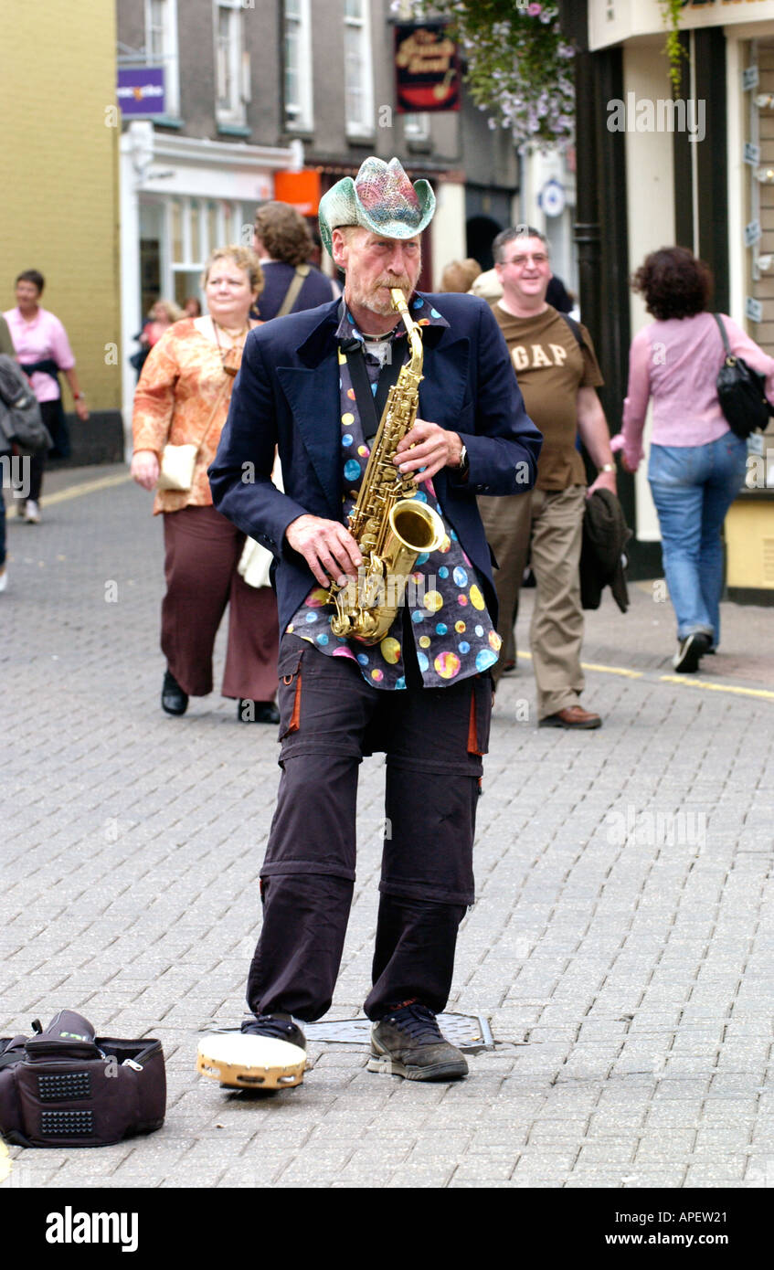 Sax player Nik Turner formerly of Hawkwind busking on the streets of Brecon  during the annual Brecon Jazz Festival UK Stock Photo - Alamy
